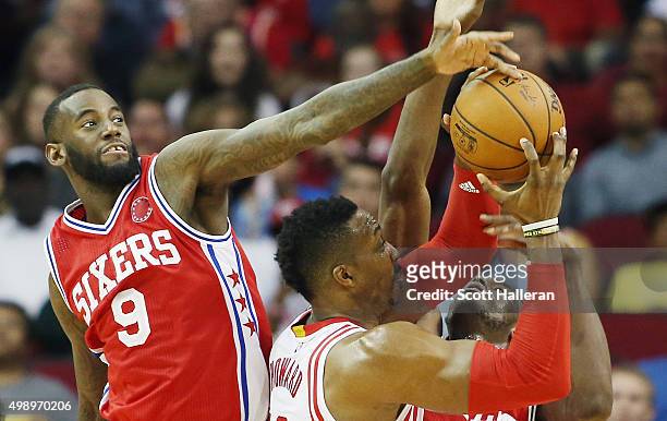 JaKarr Sampson of the Philadelphia 76ers blocks a shot by Dwight Howard of the Houston Rockets during their game at the Toyota Center on November 27,...