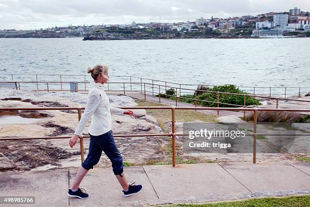 mature women exercising at the beach - bondi beach walk stock pictures, royalty-free photos & images