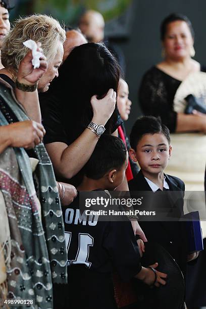 Widow of Jonah Lomu, Nadene Lomu follows behind the casket carrying the body of Jonah Lomu with her mother Lois Kuiek and her two sons, Brayley Lomu...