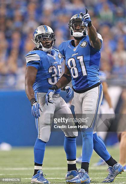 Calvin Johnson and Joique Bell of the Detroit Lions celebrate a first down during the third quarter of the game against the Philadelphia Eagles on...