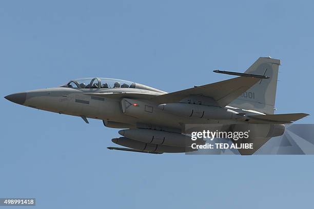 South Korean-made FA-50 multirole light fighter aircraft performs a fly-past during a ceremony prior to landing at the Clark Air Base in Angeles...