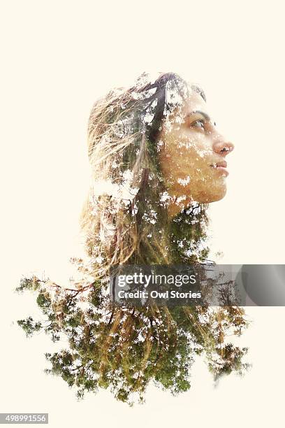 double exposure of a young woman and trees - double exposure woman fotografías e imágenes de stock