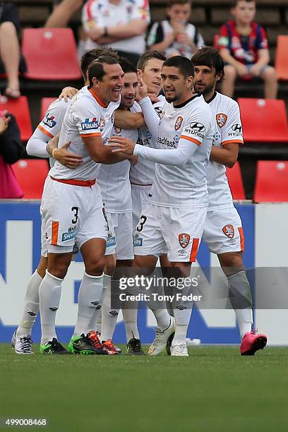 Brisbane Roar players celebrate a goal during the round eight A-League match between the Newcastle Jets and Brisbane Roar at Hunter Stadium on...