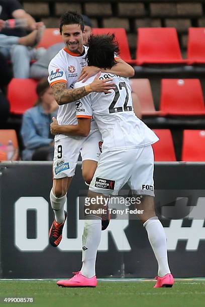 Jamie Maclaren and Thomas Broich of the Roar celebrate a goal during the round eight A-League match between the Newcastle Jets and Brisbane Roar at...