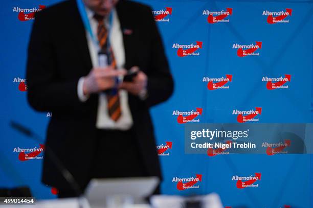 Delegate looks on his mobile phone during AfD federal party congress on November 28, 2015 in Hanover, Germany. The AFD aims to enter three new state...