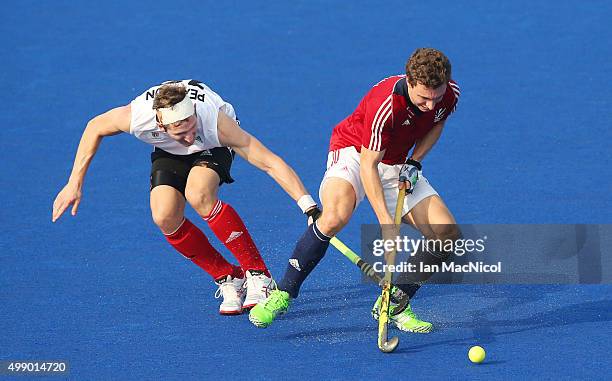 Mark Pearson of Canada vies with Nick Catlin of Great Britain during the match between Great Britain and Canada on day two of The Hero Hockey League...