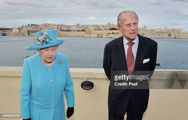 Queen Elizabeth II and Prince Philip, Duke of Edinburgh after looking at the view from the Kalkara heritage site in Valletta Harbour on November 28,...