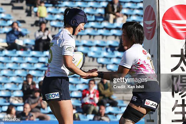 Mifuyu Koide celebrates with Yume Ohkuroda of Japan during the World Sevens Asia Olympic Qualification match between Japan and Guam at Prince...