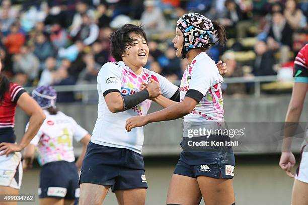 Makiko Tomita of Japan celebrates with teammate after scoring during the World Sevens Asia Olympic Qualification match between Japan and Hong Kong at...