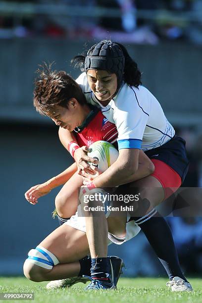 Lai Pou Fan of Hong Kong is tackled by Baratova Amina of Kazakhstan during the World Sevens Asia Olympic Qualification match between Hong Kong and...