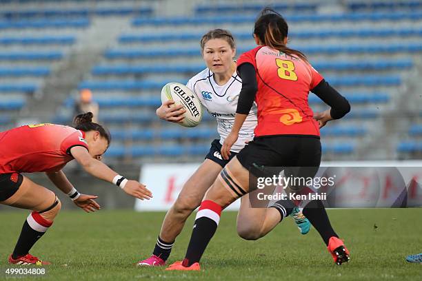 Koishybayeva Balzhan of Kazakhstan runs with the ball during the World Sevens Asia Olympic Qualification match between China and Kazakhstan at Prince...