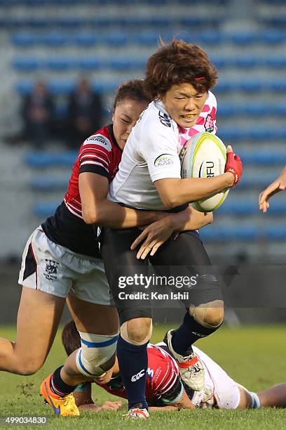 Yuka Kanematsu of Japan runs with the ball during the World Sevens Asia Olympic Qualification match between Japan and Hong Kong at Prince Chichibu...