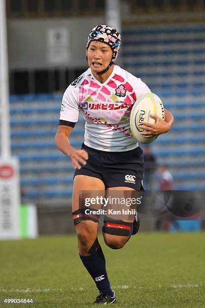 Makiko Tomita of Japan runs with the ball during the World Sevens Asia Olympic Qualification match between Japan and Hong Kong at Prince Chichibu...