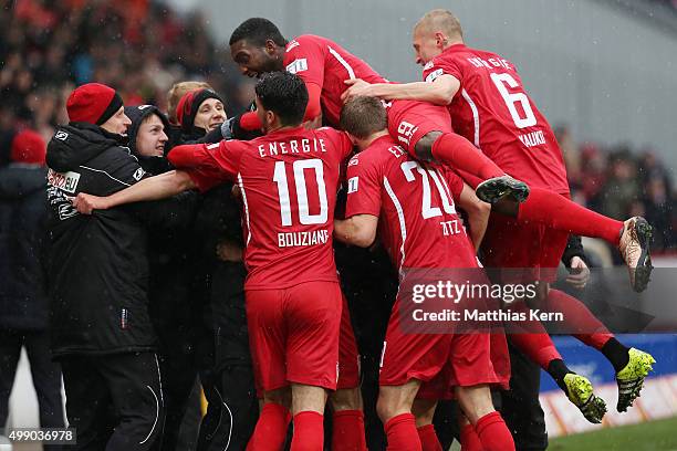 Christopher Schorch of Cottbus jubilates with team mates after scoring the first goal during the third league match between FC Energie Cottbus and RW...