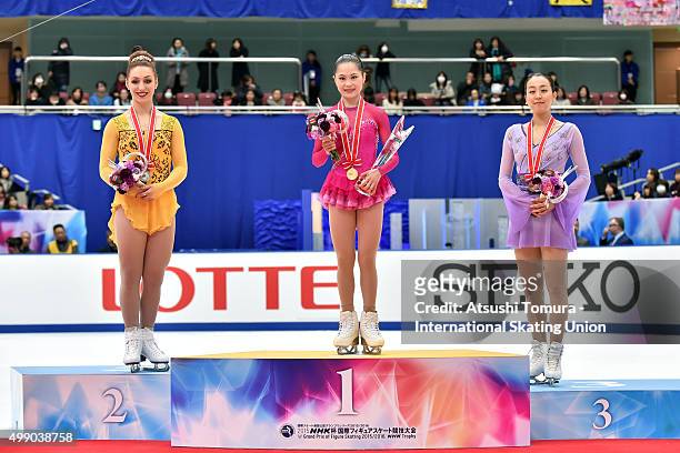 Courtney Hicks of the USA, Satoko Miyahara and Mao Asada of Japan poseon the podium during the day two of the NHK Trophy ISU Grand Prix of Figure...