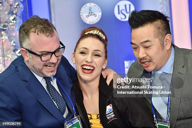 Courtney Hicks of the USA celebrates with her coaches after winning silever medal in the ladies's free skating during the day two of the NHK Trophy...