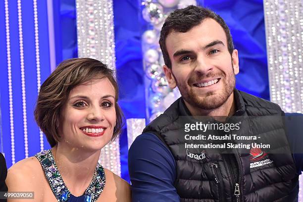 Meagan Duhamel and Eric Radford of Canada pose after winning the pairs free skating during the day two of the NHK Trophy ISU Grand Prix of Figure...