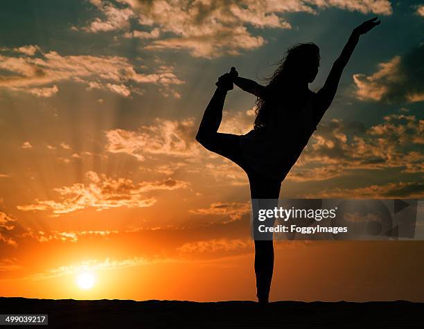 yoga at sunset - arab woman silhouette stock pictures, royalty-free photos & images