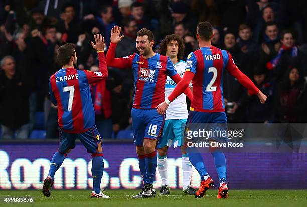 James McArthur of Crystal Palace celebrates scoring his team's first goal with his team mates Yohan Cabaye and Joel Ward during the Barclays Premier...