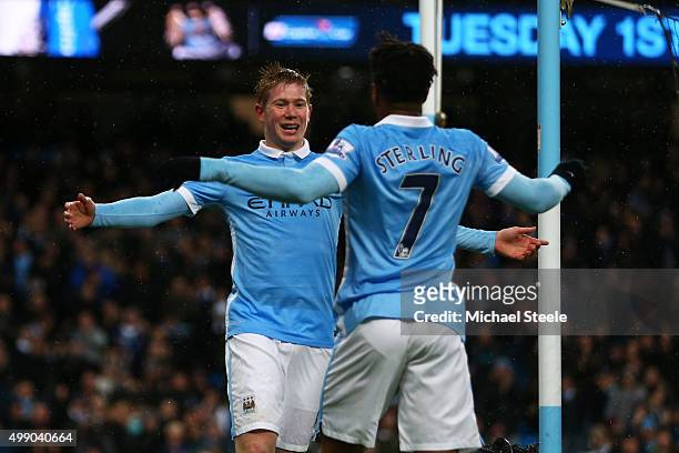 Kevin de Bruyne of Manchester City celebrates scoring his team's first goal with his team mate Raheem Sterling during the Barclays Premier League...