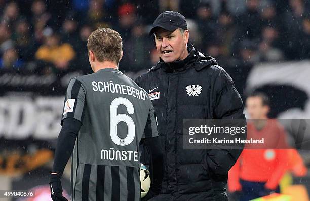 Headcoach Ralf Loose talks to Kevin Schoeneberg of Muenster during the Third League match between SG Dynamo Dresden and Preussen Muenster at...