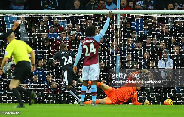 Odion Ighalo of Watford scores his team's first goal past Brad Guzan of Aston Villa during the Barclays Premier League match between Aston Villa and...