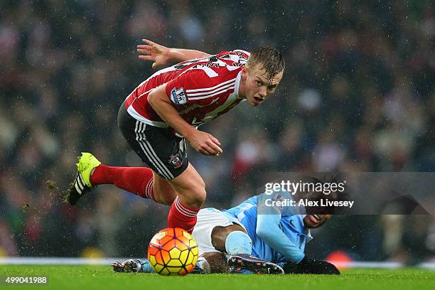 James Ward-Prowse of Southampton and Raheem Sterling of Manchester City compete for the ball during the Barclays Premier League match between...