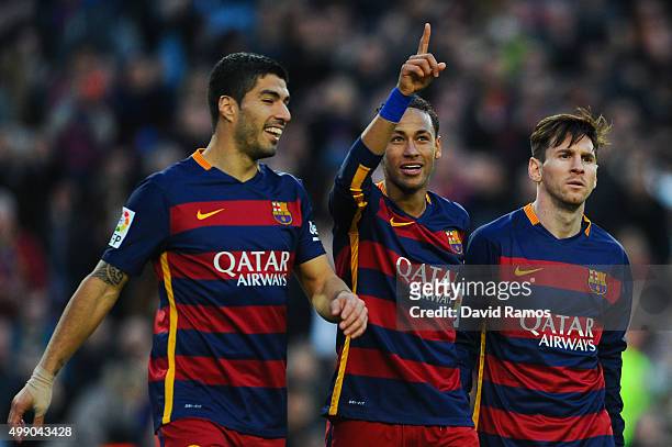 Neymar of FC Barcelona celebrates with his teammates Luis Suarez and Lionel Messi of FC Barcelonaa after scoring his team's third goal of FC...