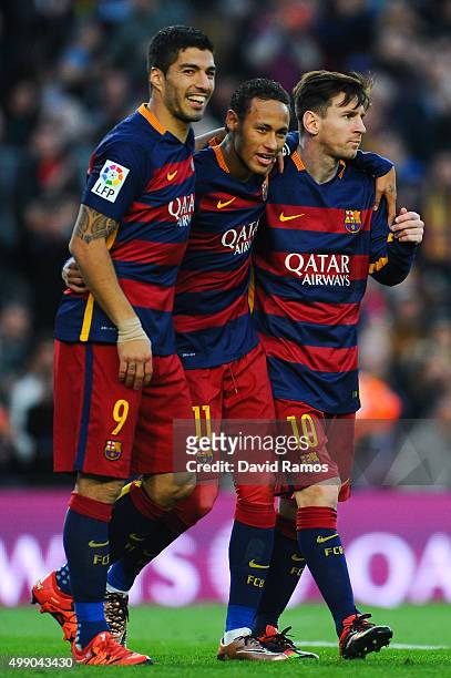 Neymar of FC Barcelona celebrates with his teammates Luis Suarez and Lionel Messi of FC Barcelonaa after scoring his team's third goal of FC...