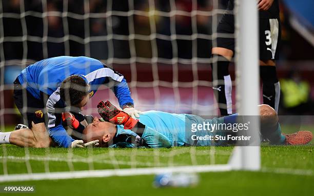 Heurelho Gomes of Watford receives medical treatment during the Barclays Premier League match between Aston Villa and Watford at Villa Park on...