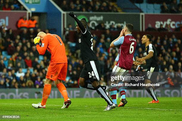 Odion Ighalo of Watford celebrates his team's second goal while Aston Villa players show their dejection after Alan Hutton of Aston Villa scored an...