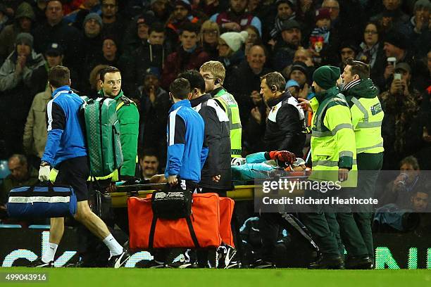 Heurelho Gomes of Watford is taken off by a stretcher after injury during the Barclays Premier League match between Aston Villa and Watford at Villa...