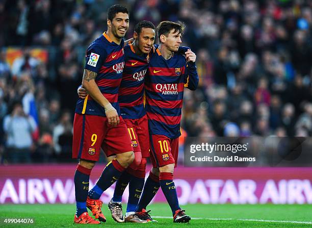 Neymar of FC Barcelona celebrates with his teammates Luis Suarez and Lionel Messi of FC Barcelonaa after scoring his team's third goal of FC...