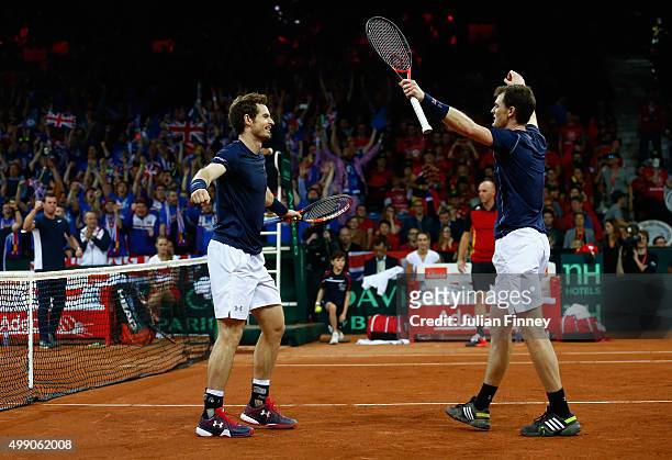 Jamie Murray and Andy Murray of Great Britain celebrate defeating Steve Darcis and David Goffin of Belgium in the doubles during day two of the Davis...
