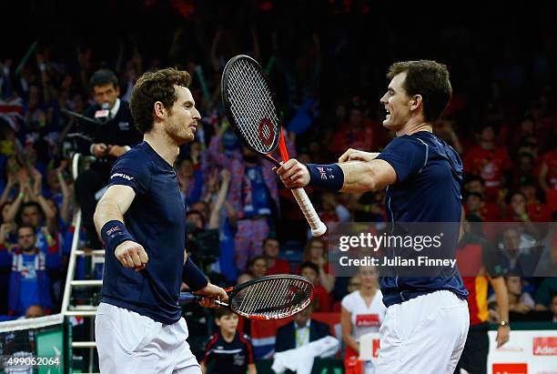 Jamie Murray and Andy Murray of Great Britain celebrate defeating Steve Darcis and David Goffin of Belgium in the doubles during day two of the Davis...