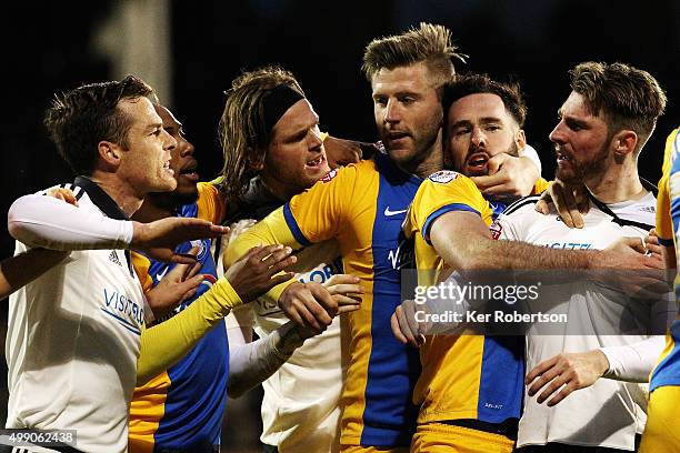 Tempers flare between the teams after Tom Clarke of Preston North End and James Husband of Fulham tussle on the ground during the Sky Bet...