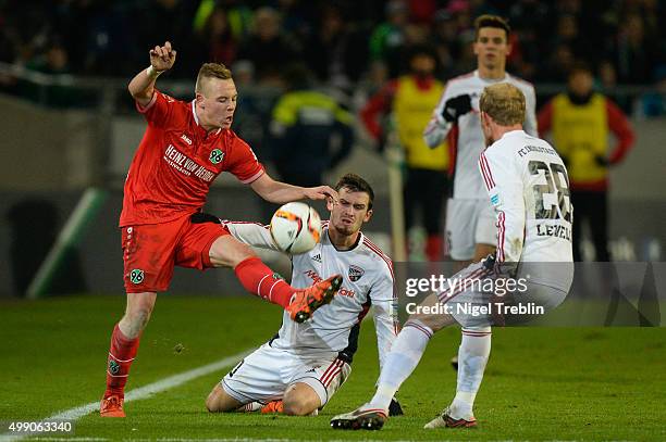 Uffe Bech of Hannover is challenged by Pascal Gross of Ingolstadt the Bundesliga match between Hannover 96 and FC Ingolstadt at HDI Arena on November...