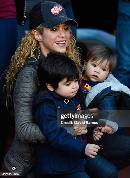 Shakira carries her children Milan and Sasha ahead of the La Liga match between FC Barcelona and Real Sociedad de Futbol at Camp Nou on November 28,...