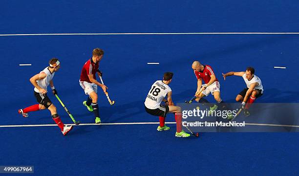 Nick Catlin of Great Britain controls the ball during the match between Great Britain and Canada on day two of The Hero Hockey League World Final at...