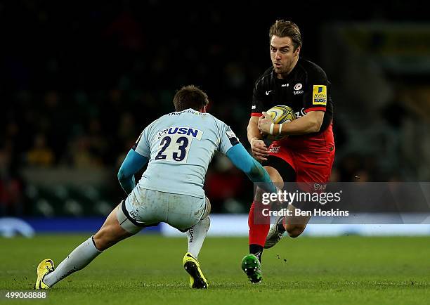 Chris Wylde of Saracens is tackled by Ben Howard of Worcester during the Aviva Premiership match between Saracens and Worcester Warriors at...