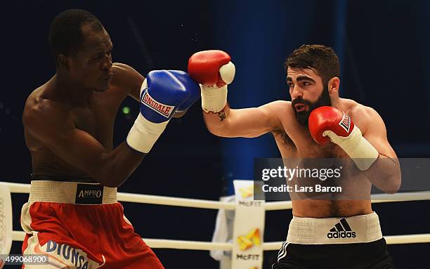 Miguel Gonzalez of Honduras in action with Jono Carroll of Ireland during their Super Featherweight fight prior to the IBF/IBO/WBA/WBO World...