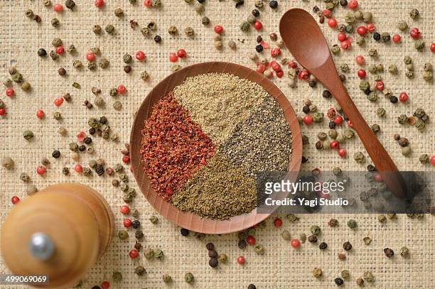 four varieties of peppercorns - pepper mill stock pictures, royalty-free photos & images