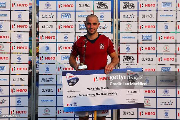 Nick Catlin of Great Britain poses with his man of the match award during the match between Great Britain and Canada on day two of The Hero Hockey...