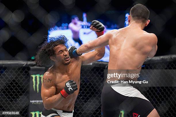 Jorge Masvidal of the United States of America throws a punch at Benson Henderson of the United States of America in their welterweight bout during...