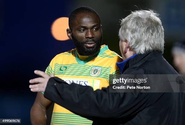 Francois Zoko of Yeovil Town is spoken to by manager Paul Sturrock prior to coming on as a substitute during the Sky Bet League Two match between...