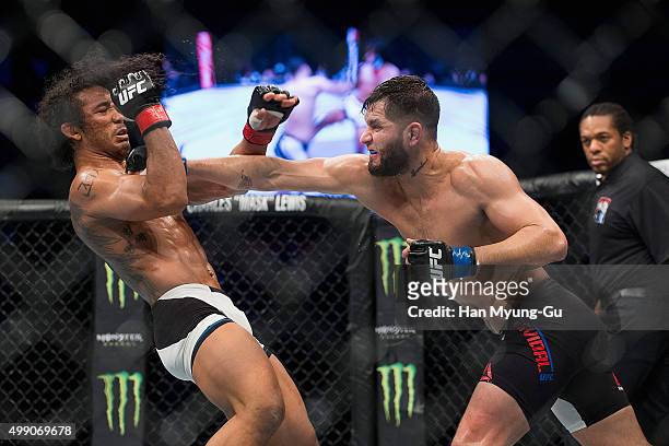 Jorge Masvidal of the United States of America throws a punch at Benson Henderson of the United States of America in their welterweight bout during...