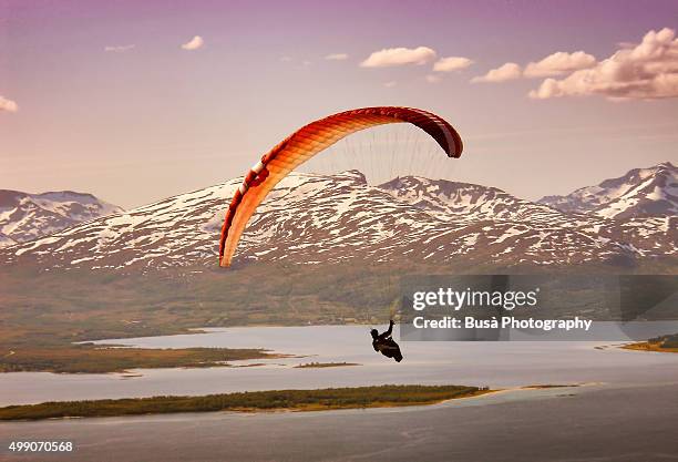 paragliding in tromso, norway - water glide stockfoto's en -beelden