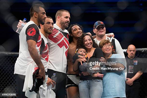 Benson Henderson of the United States of America celebrates with his family after his win over Jorge Masvidal of the United States of America in...
