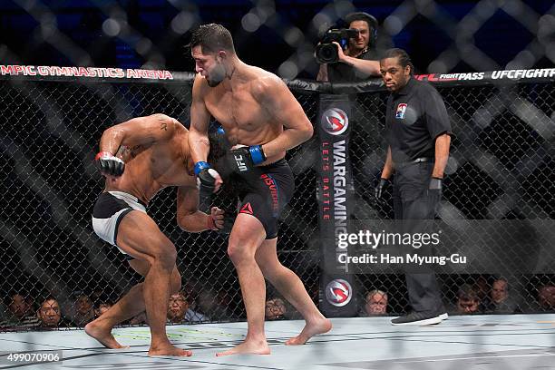 Jorge Masvidal of the United States of America throws a punch at Benson Henderson of the United States of America in their welterweight bout during...