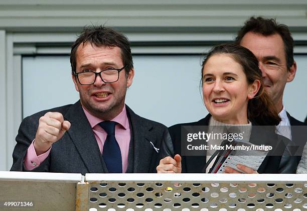 James Purefoy and Jessica Adams watch the racing as they attend the Hennessy Gold Cup horse racing meet at Newbury Racecourse on November 28, 2015 in...